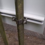 Close of saddle clamps on railings