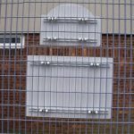 alupanel fitted to fence with channel and saddle clamps rear view